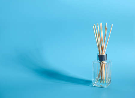 air freshener sticks isolated on blue backgroundの写真素材