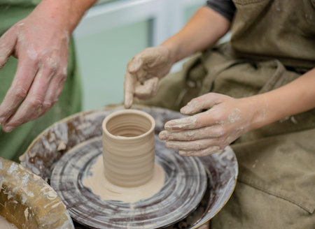 Modeling by hand. Potters wheel. Pottery workshop