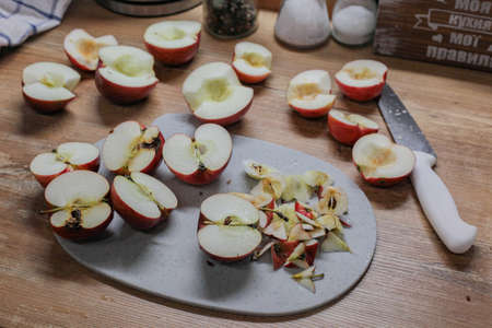 sliced apples. Peeling apples in the kitchenの写真素材