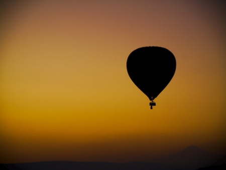 Balloon in sunrise over Cappadocia in Turkeyの写真素材
