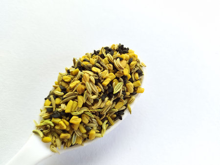 Panch phoron - A mixture of five spices on white background.