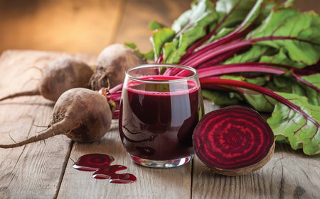 on a wooden table , there are Beetroots ,a jug and two glasses of fresh juice with Beetroot pices. Food made from natural productsの素材