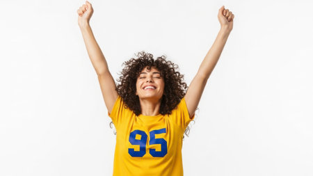 A joyful individual wearing a sports jersey with the number 95 raises their arms in celebration against a plain white background.の素材