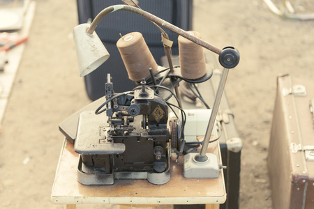 Flea market. Sale of old things. Industrial sewing machines from the USSR.のeditorial素材