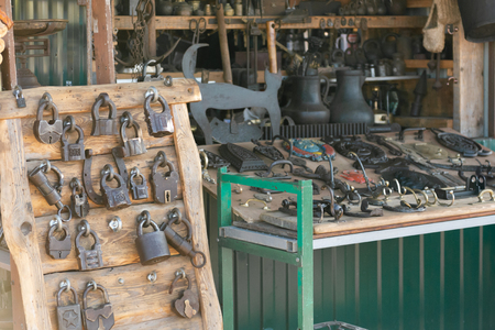 Flea market. Sale of old things. Hardware store. Goods from smithery.のeditorial素材