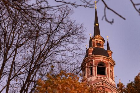 Gothic Orthodox Cathedral. Neo-Gothic Orthodox Church with Masonic symbols. Church spire against the blue sky.の写真素材