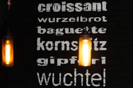 Menu on the wall under the light of lamps. Lamp in the interior.の写真素材