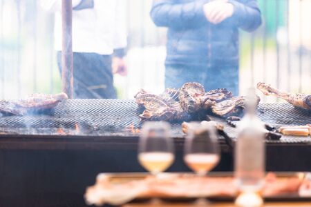 The meat on the grill. Cooking meat by Italian cooks. Meat festival in Tuscany. May 2019.の写真素材