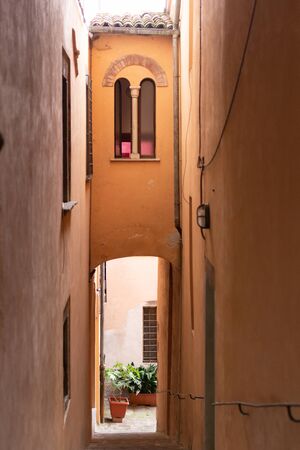 The Town Of Barga. Italy. Summer 2019. The narrow street descends. Street in the Central part of the historic center.の写真素材