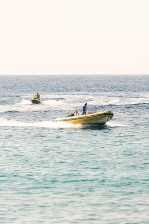 Pathos. Cyprus. The November 2019. Motor boat and jet ski. People have fun on vacation.のeditorial素材