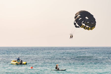 Pathos. Cyprus. The November 2019. Boat towing a parachute. People have fun on vacation.のeditorial素材