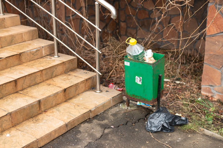 Moscow. Russia. December 2019. Garbage crisis. Overflowing street trash bins. Poor cleaning of the...