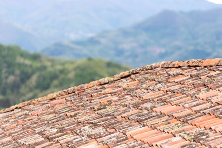Clay tiles close-up. Old tiles on the houses of Tuscany. The old technology is better than the new ones.の写真素材