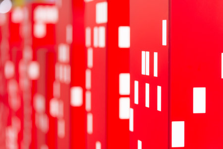 Red towers with white Windows. Unnatural layouts of houses. Abstraction of city houses and burning Windows.の写真素材