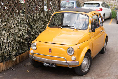 Barga. Italy. Summer 2019. Old small car in the city. Only such a car can move around the streets of Bargaのeditorial素材