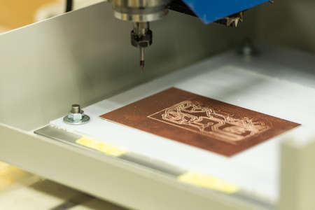 Machine for the production of chips. The blank chip lies on the table of the machineの写真素材