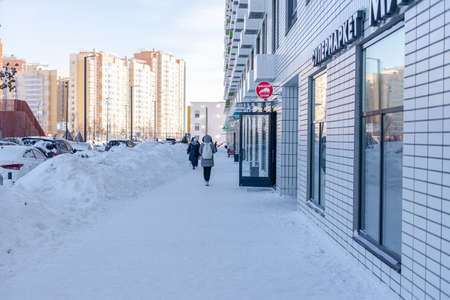 Moscow. Russia. February 2021. Cleared the snow from the paths after a huge snowfall. Deep walking paths in Moscow.のeditorial素材