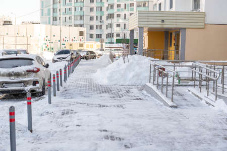 Moscow. Russia. February 2021. Cleared the snow from the paths after a huge snowfall. Deep walking paths in Moscow.のeditorial素材