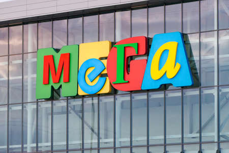 Mega name of the retail chain. The emblem on the glass facade.のeditorial素材
