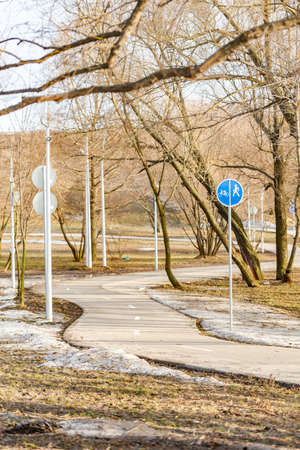 Bicycle path in Kapotnya Park. Marked paths for pedestrians and cyclists. Spring in the big park.の写真素材