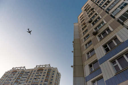 Moscow. Russia. Autumn 2018. The plane over the apartment block. Glissada passes over high-rise buildings. Noise from planes prevents sleepのeditorial素材