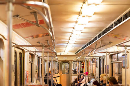 Moscow. Russia. Autumn 2019. People ride in a subway car. Retro train runs on the red line in Moscow.のeditorial素材