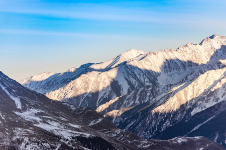 Elbrus region in the sunlight. A large valley among the steep Caucasus mountains.の写真素材