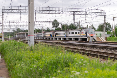 Moscow oblast. Russia. Summer 2020. Platform with electric train. Large station with platform, train...