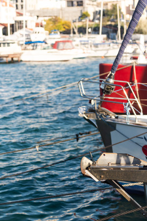 Anchor devices on the bow of yachts in the marina.