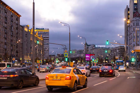 Moscow. Russia. Autumn 2019. A garden ring filled with cars. A wide highway in the center of the metropolis in the evening. Very heavy traffic in a huge city.の写真素材
