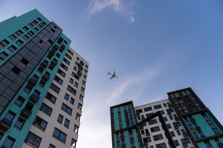Houses in Moscow. Housing complex "Scandinavia". Flying plane over the houses.の写真素材