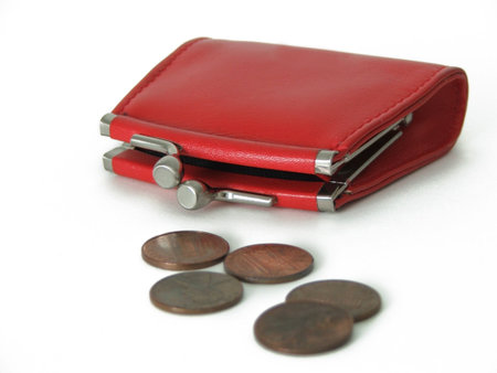 isolated red coin purse with five pennies