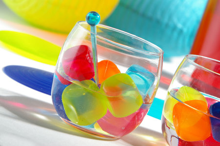 Table setting at a fun, summery party. Horizontal format.