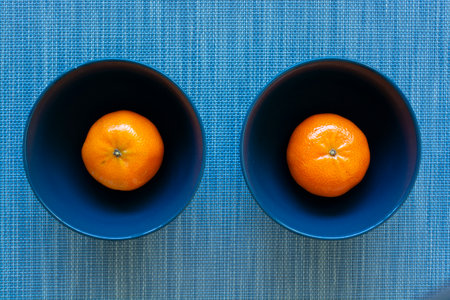 Sweet tangerines on color backgroundの写真素材