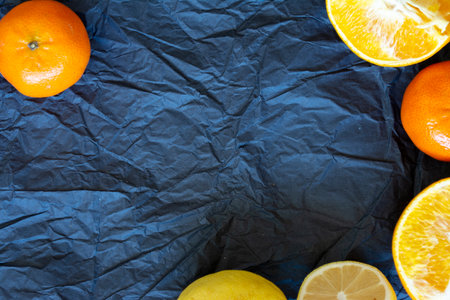 citrus food flat lay border pattern on blue background - assorted citrus fruitsの写真素材