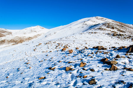 High mountains under snow in the winterの写真素材