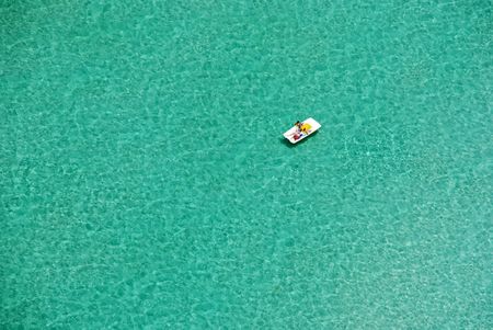 Aerial view of boat in open ocean / seaの写真素材