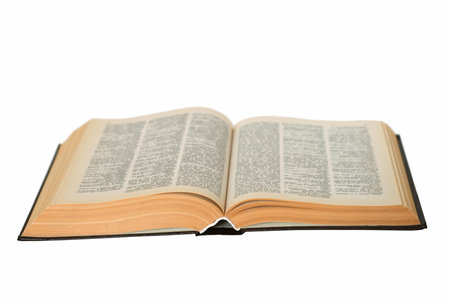 Open old book isolated on a white background