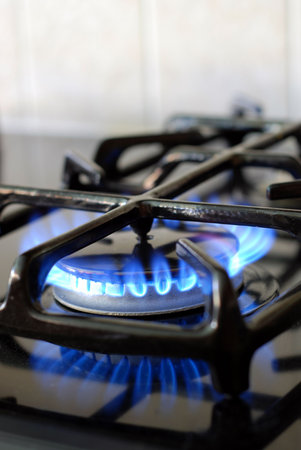 Burning gas oven in kitchen