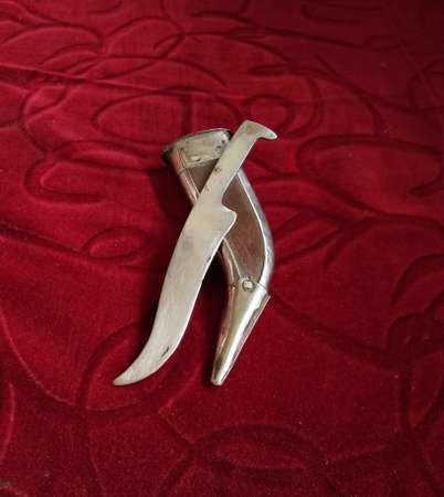 Knife with scabbard. This style of knife is famous due to it's use for self defence by the Sikh community. This style of knife is also known as'kirpan'.の写真素材