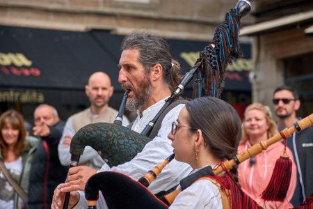Vigo, Pontevedra, Spain; April 7, 2024; The drum and bagpipe groups do not stop playing during the Reconquest of Vigo festivalのeditorial素材
