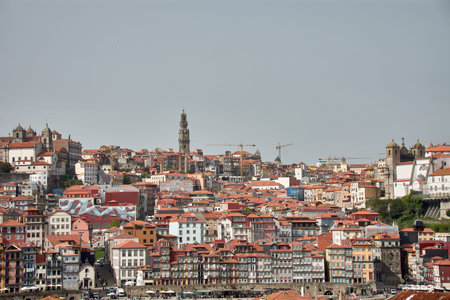Porto, Portugal - March,28,2022:Porto, the old town of Portugal on the Douro river with traditional Rabelo boats.Old neighborhood and its typical colorful houses on the water's edgeのeditorial素材
