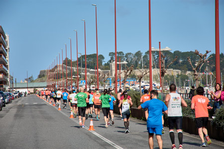 Baiona, Pontevedra, Galicia, Spain; March,26,2023; athletes running in line in the race that goes from Vigo to Baiona, almost at the end of the raceのeditorial素材