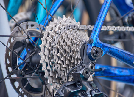 Close-up of the intricate details of a professional bicycle's gears, focusing on the cassette...