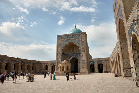 Bukhara, Uzbekistan;September,20,2024:The courtyard of Poi Kalyan Madrasa in Bukhara, Uzbekistan, is a stunning example of Islamic architecture and design. This historic madrasa is part of the larger Po-i-Kalyan complex, which includes the famous Kalyan Mosque and Minaret. The vast open courtyard is surrounded by intricate archways, offering a peaceful space that once served as a center for learning and scholarship.の写真素材