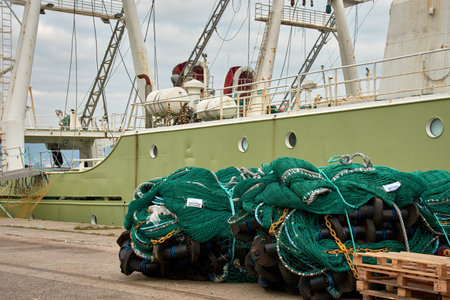 Vigo,Pontevedra,Spain; December,28,2024:A close-up image showcasing new fishing nets meticulously prepared for loading onto a deep-sea fishing vessel at the port of Vigo, located in Orillamar, Galicia, Spain. The vibrant colors and intricate details of thのeditorial素材
