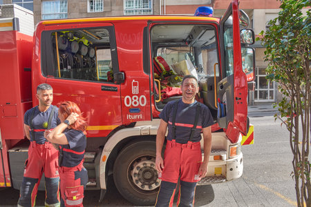 Vigo, Spain, March 19, 2026,A group of professional firefighters pose with determination and pride...