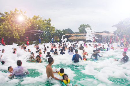 Pattaya, Thailand, August, 3, 2019, waterpark foam party in small pool..