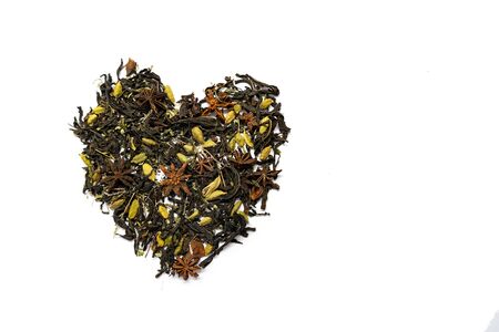 herbal tea in the shape of a heart is in white background, concept of love. Place for your text. Isolatedの写真素材