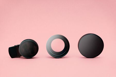 Closeup of smartphone lens on pink background. Space for text. Digital concept.の写真素材